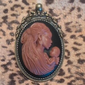 Elegant Cameo Pendant in Black and Brown